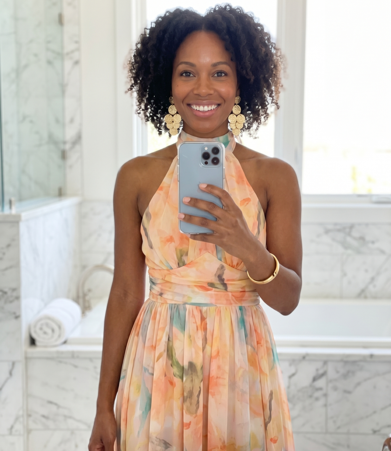 Black woman customer mirror selfie wearing floral dress — Emmie & Ellie verified buyer review