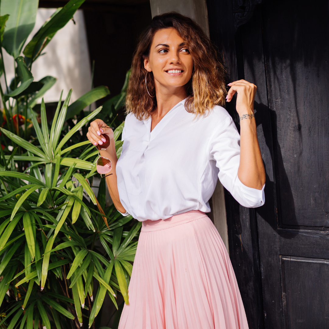 Woman in white blouse and pink skirt with sunglasses outdoors — Emmie & Ellie tops and blouses