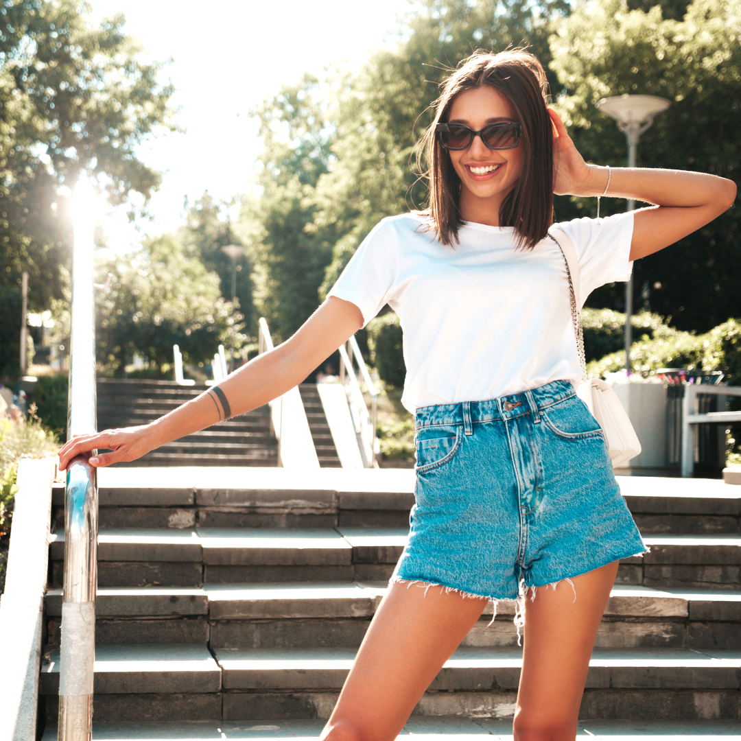 Woman in stylish casual shorts on sunny summer street — Emmie & Ellie women's shorts