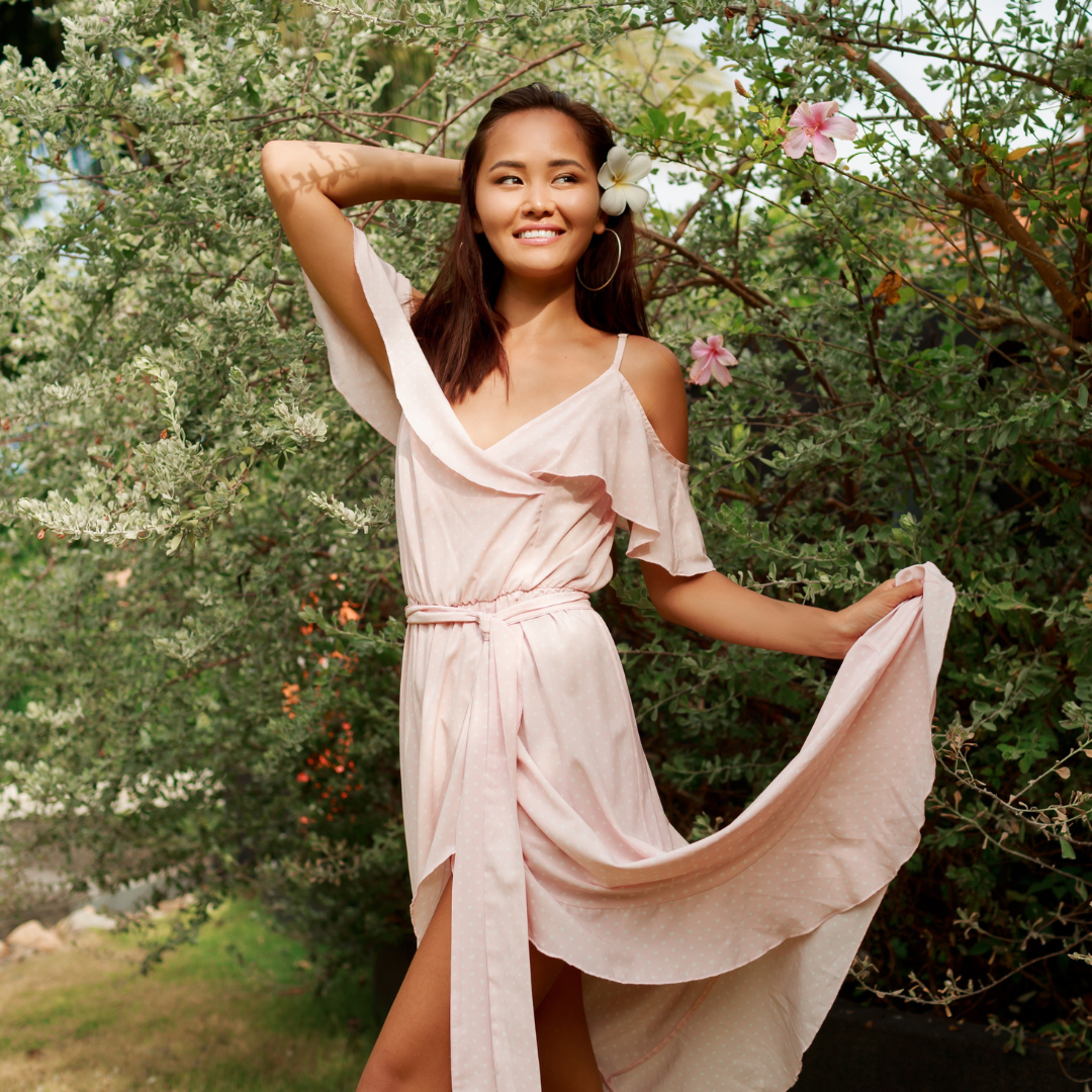 Woman in elegant dress at outdoor garden wedding — Emmie & Ellie wedding guest dresses